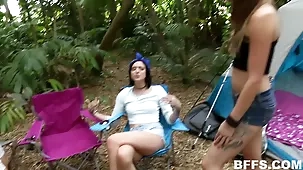 Young lesbian friends flirt and flash in the woods