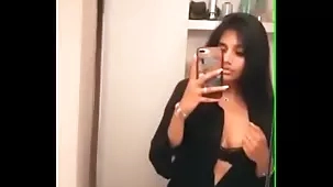 Indian teen with big tits performs a sensual striptease