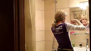 Teen Katie's erotic shower session with blonde hair and costume